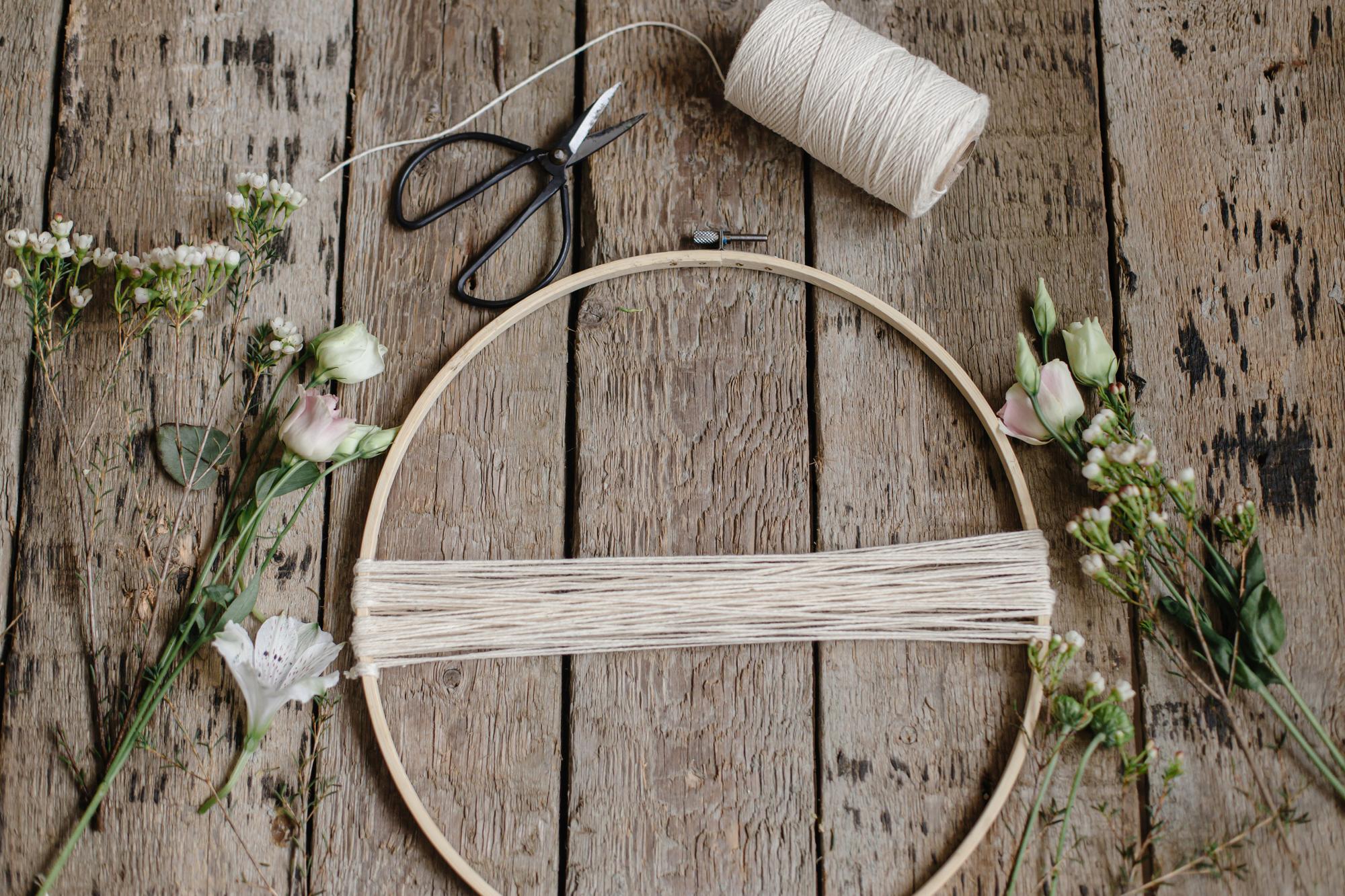 Artisan hands preparing embroidery hoop in workshop